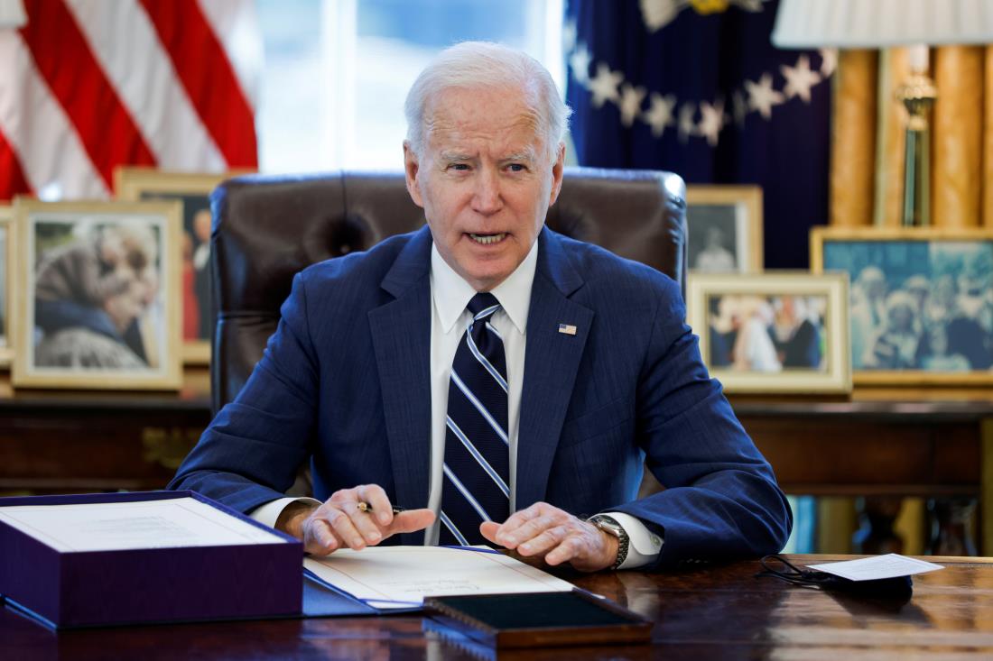 U.S. President Joe Biden signs the American Rescue Plan, a package of eco<em></em>nomic relief measures to respond to the impact of the coro<em></em>navirus disease (COVID-19) pandemic, inside the Oval Office at the White House in Washington, U.S., March 11, 2021. REUTERS/Tom Brenner
