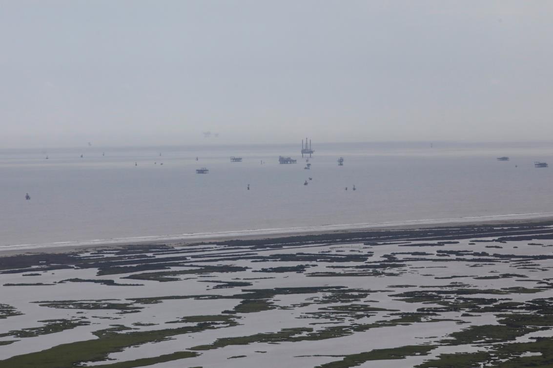 Oil rigs are seen in the Gulf of Mexico after Hurricane Ida made landfall in Louisiana, in Grand Isle, Louisiana, U.S. August 31, 2021. REUTERS/Marco Bello/File Photo/File Photo