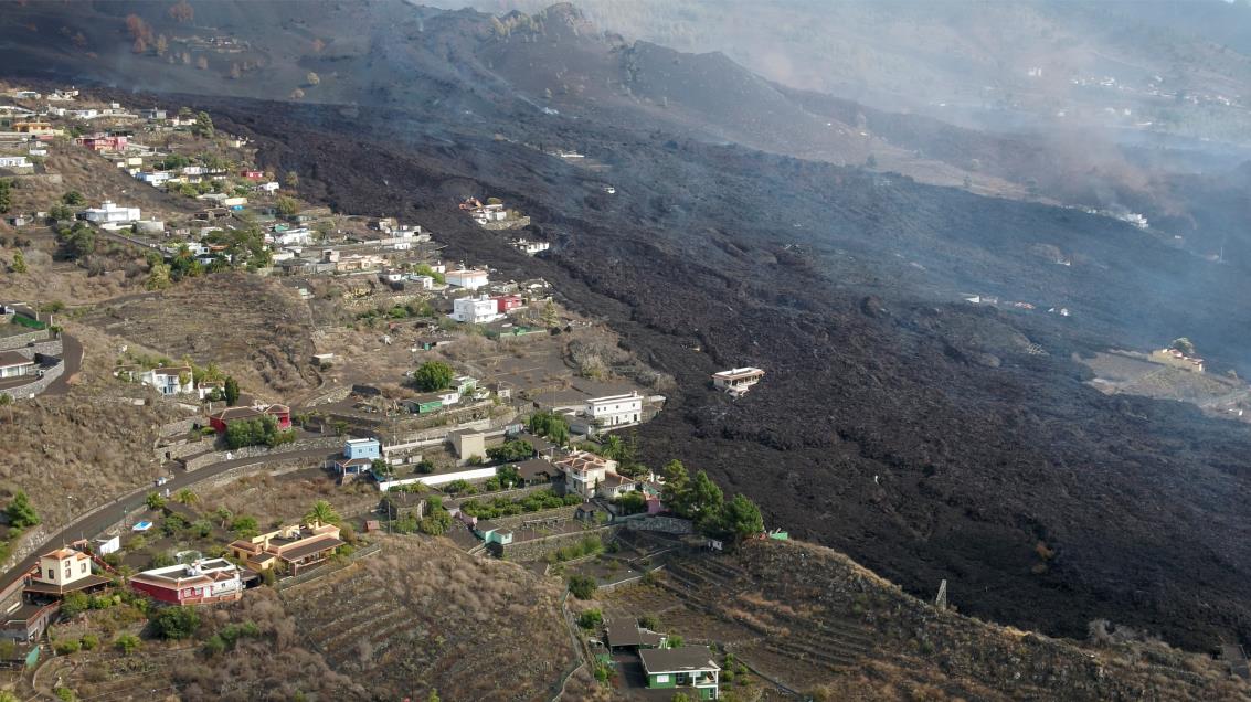 A screengrab from drone footage shows lava flowing following the eruption of a volcano in the Cumbre Vieja park, on the Canary Island of La Palma, Spain September 26, 2021. REUTERS TV via REUTERS