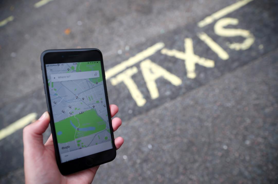 The Uber application is seen on a mobile phone in London, Britain, September 14, 2018. REUTERS/Hannah McKay/File Photo