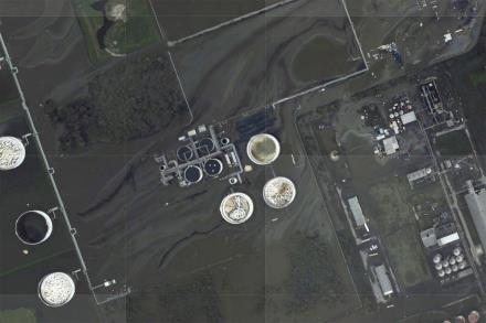 A sheen appears on the flooded property of the Phillips 66 Alliance Refinery, following the passing of Hurricane Ida in an NOAA surveillance photograph taken south of Belle Chasse, Louisiana, U.S. August 31, 2021. NOAA/Handout via REUTERS 