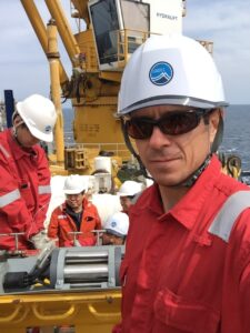 Wearing protective drilling gear.